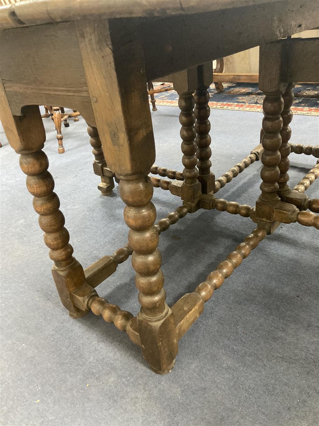 An 18th century and later oak bobbin leg gateleg dining table, length 170cm extended, width 162cm, height 76cm